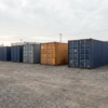 Shipping containers in a dealer yard, how much does a shipping container cost